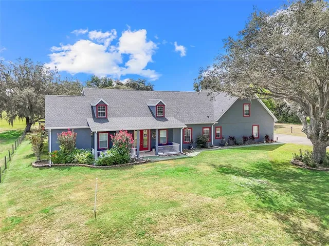 a front view of house with yard and green space