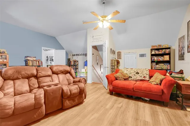 a bedroom with bed and a book shelf