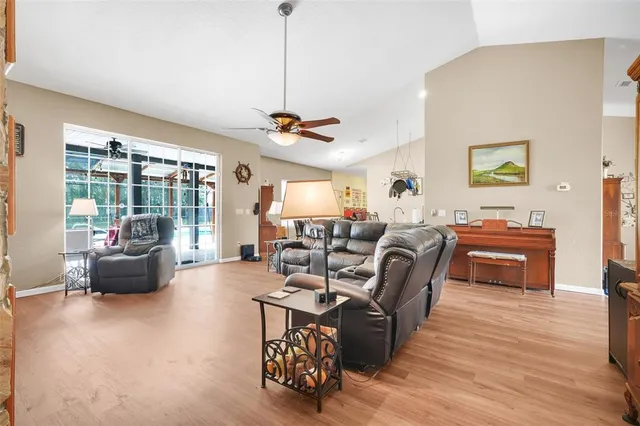 a living room with furniture a couch and a table