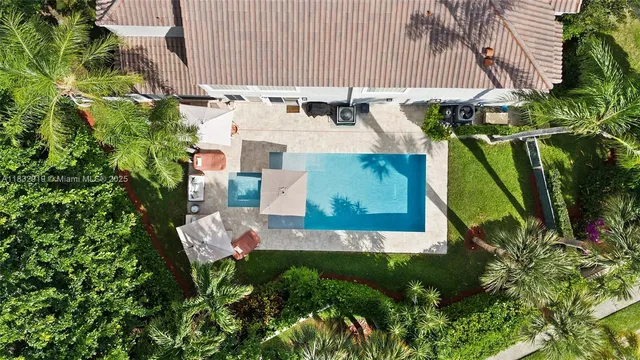 an aerial view of house with yard