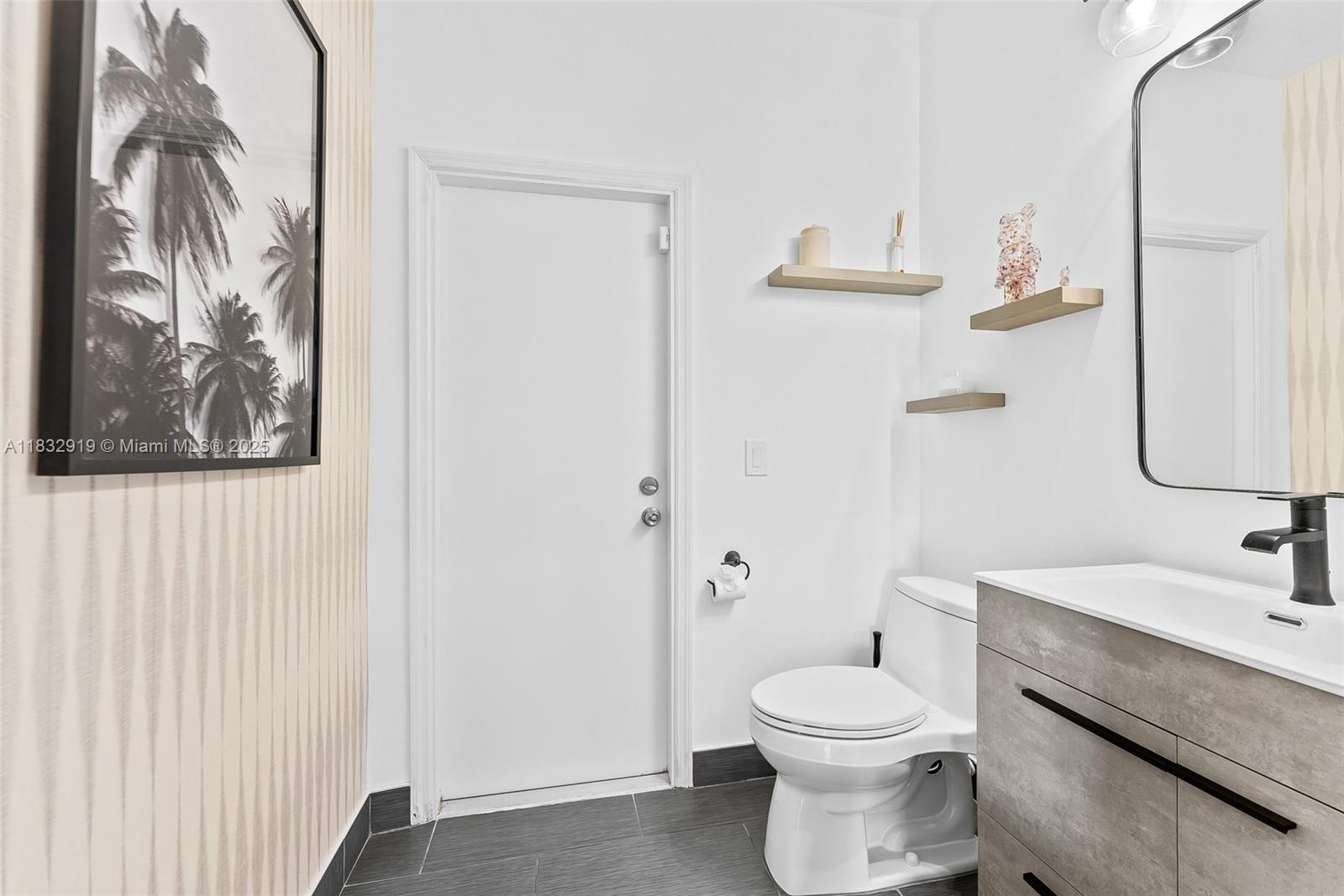 17723 Tiffany Trace Drive Boca Raton, FL 33487 - Photo 15 of 44 a bathroom with a toilet a sink and mirror