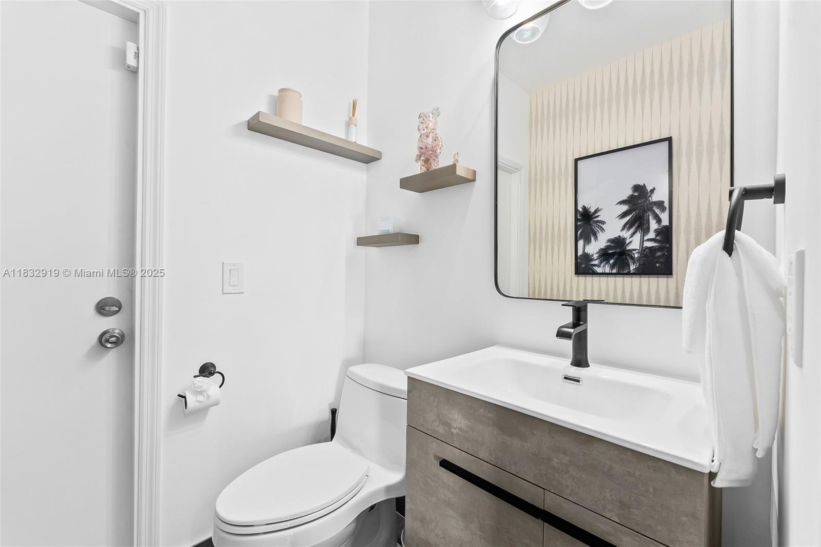 17723 Tiffany Trace Drive Boca Raton, FL 33487 - Photo 16 of 44 a bathroom with a toilet sink and a mirror