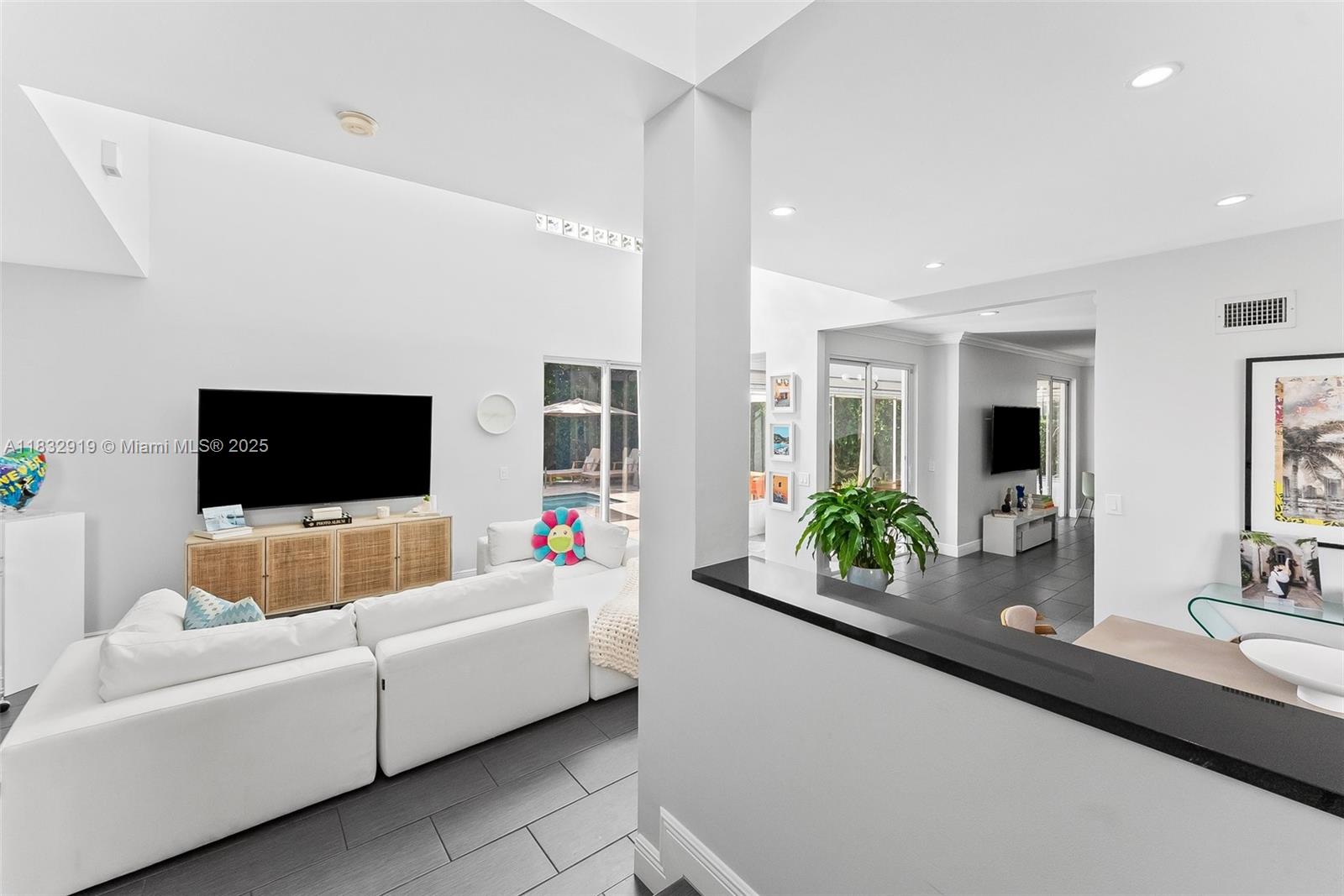 17723 Tiffany Trace Drive Boca Raton, FL 33487 - Photo 2 of 44 a living room with furniture and a flat screen tv