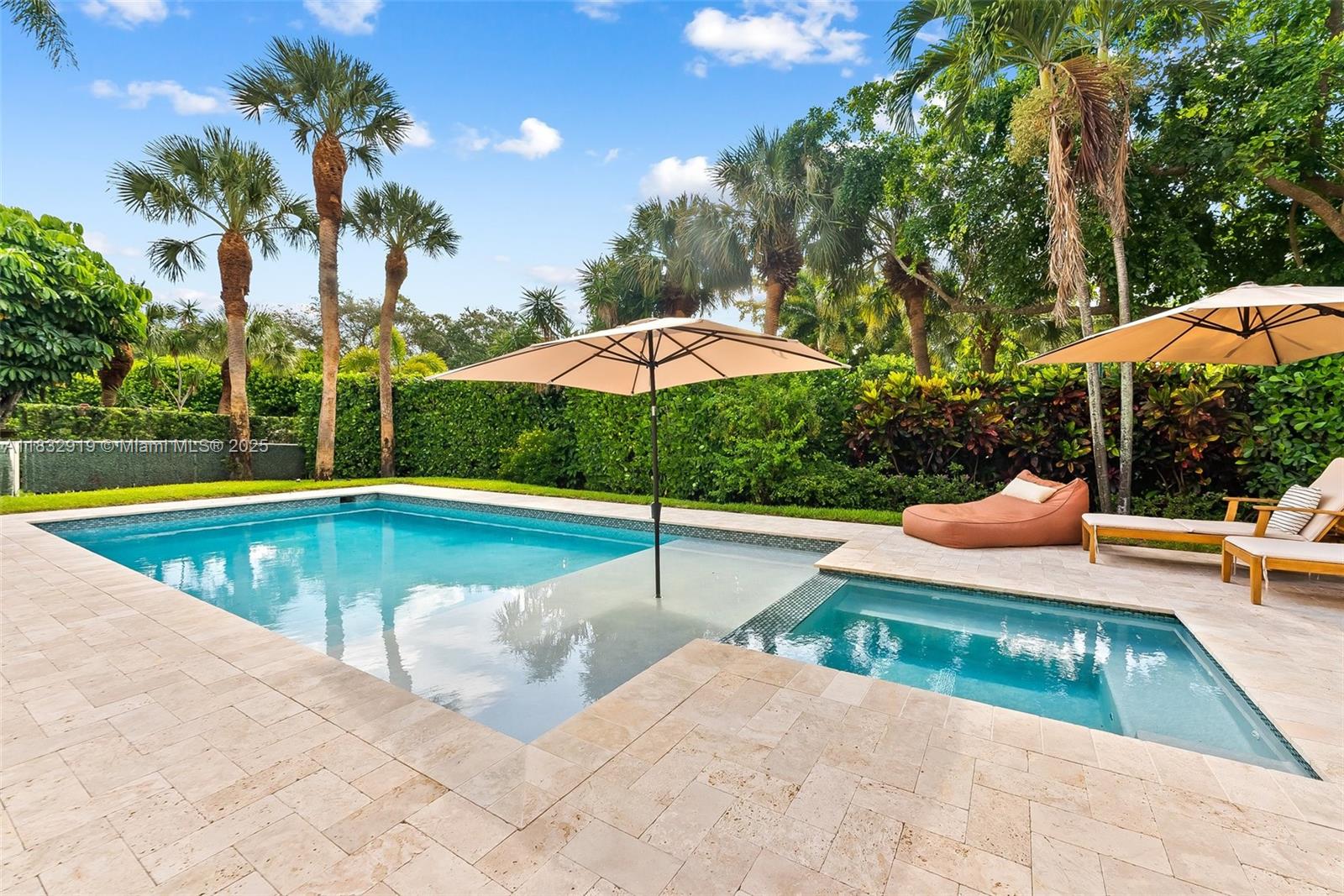 17723 Tiffany Trace Drive Boca Raton, FL 33487 - Photo 23 of 44 a view of pool with lawn chairs under an umbrella