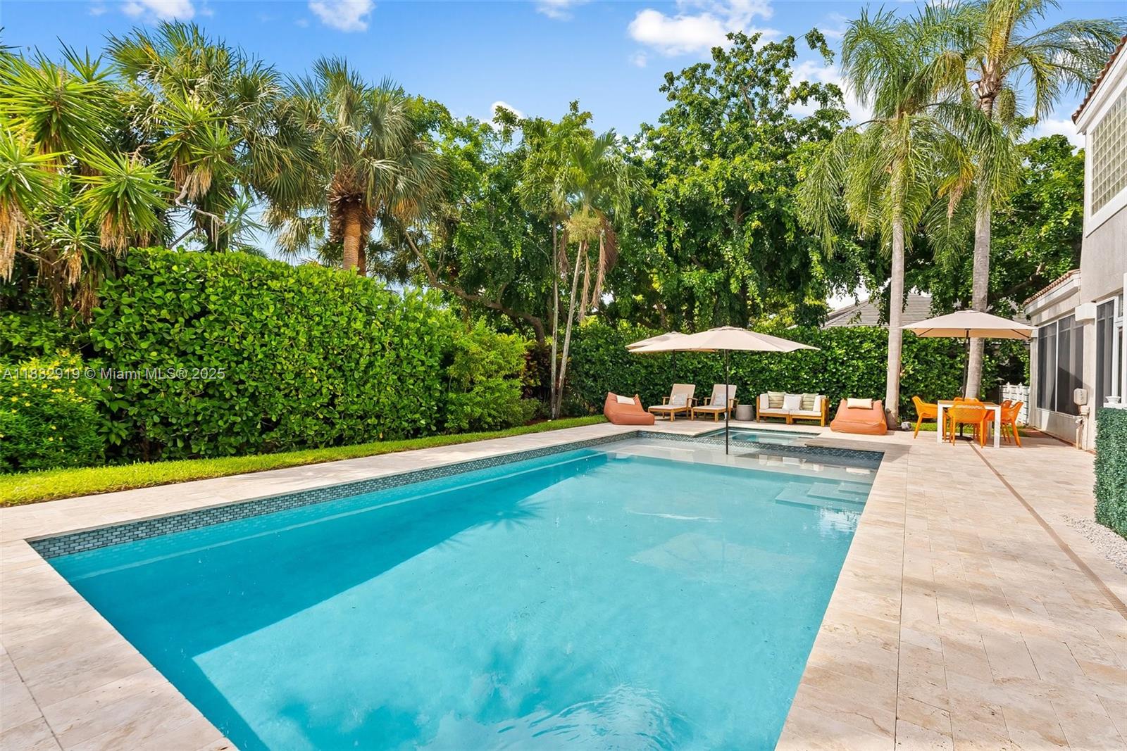 17723 Tiffany Trace Drive Boca Raton, FL 33487 - Photo 27 of 44 a view of swimming pool with lawn chairs under an umbrella