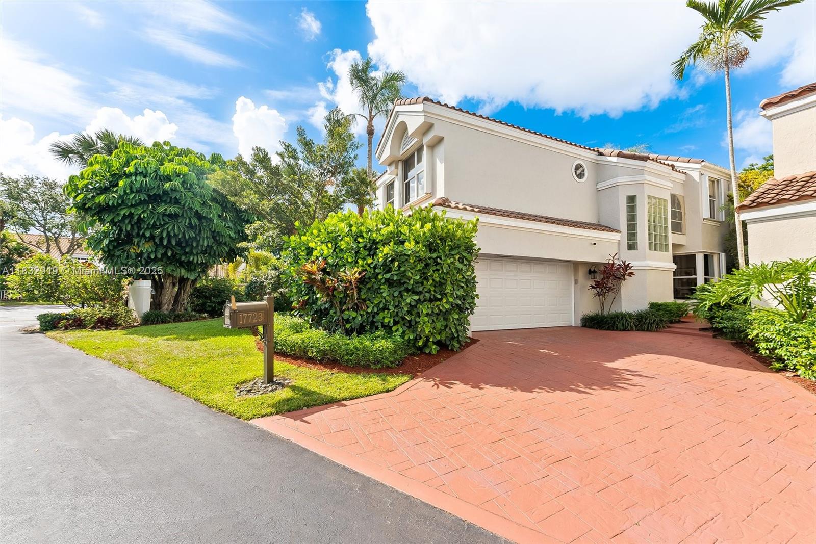17723 Tiffany Trace Drive Boca Raton, FL 33487 - Photo 28 of 44 a front view of a house with a yard and garage