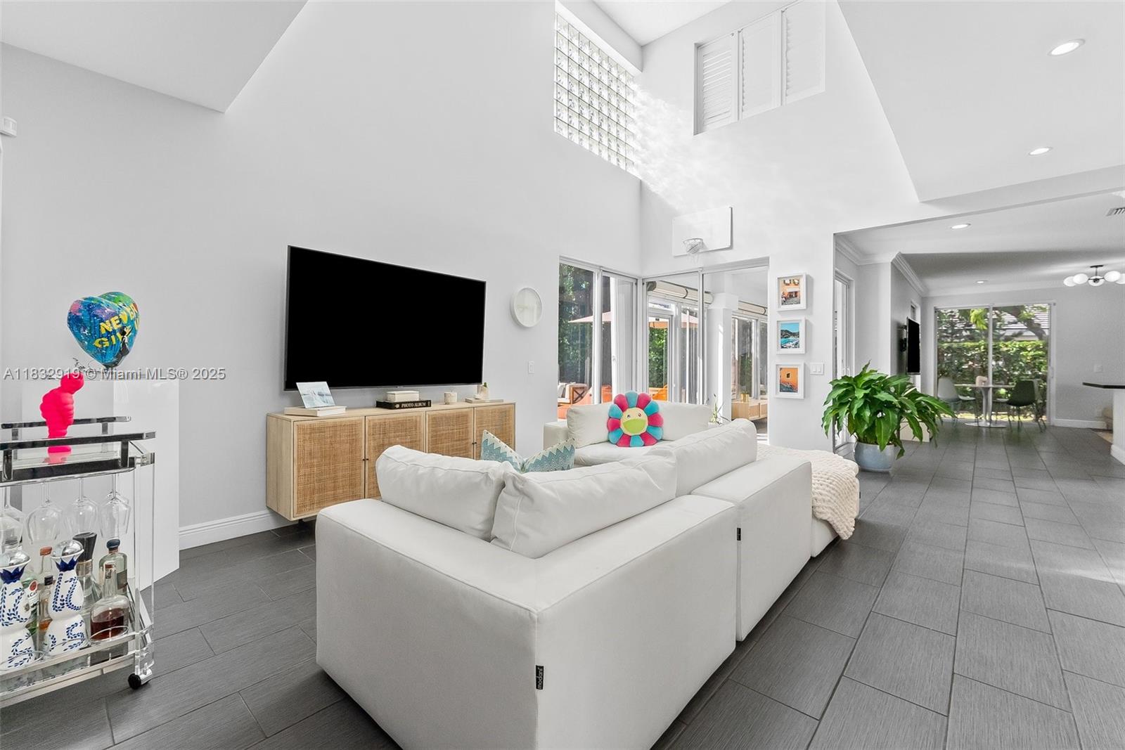17723 Tiffany Trace Drive Boca Raton, FL 33487 - Photo 3 of 44 a living room with furniture and a flat screen tv