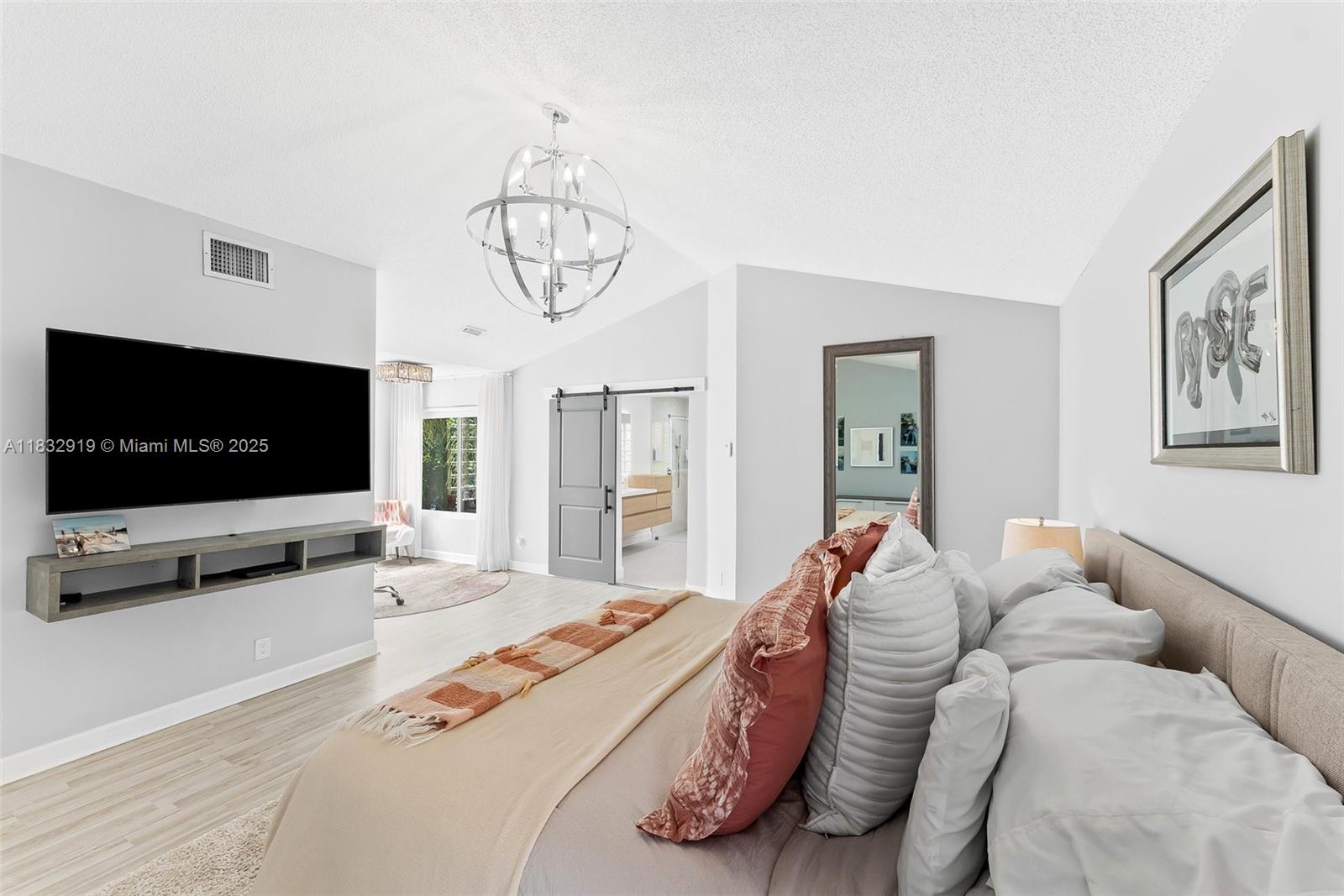 17723 Tiffany Trace Drive Boca Raton, FL 33487 - Photo 31 of 44 a living room with furniture and a flat screen tv