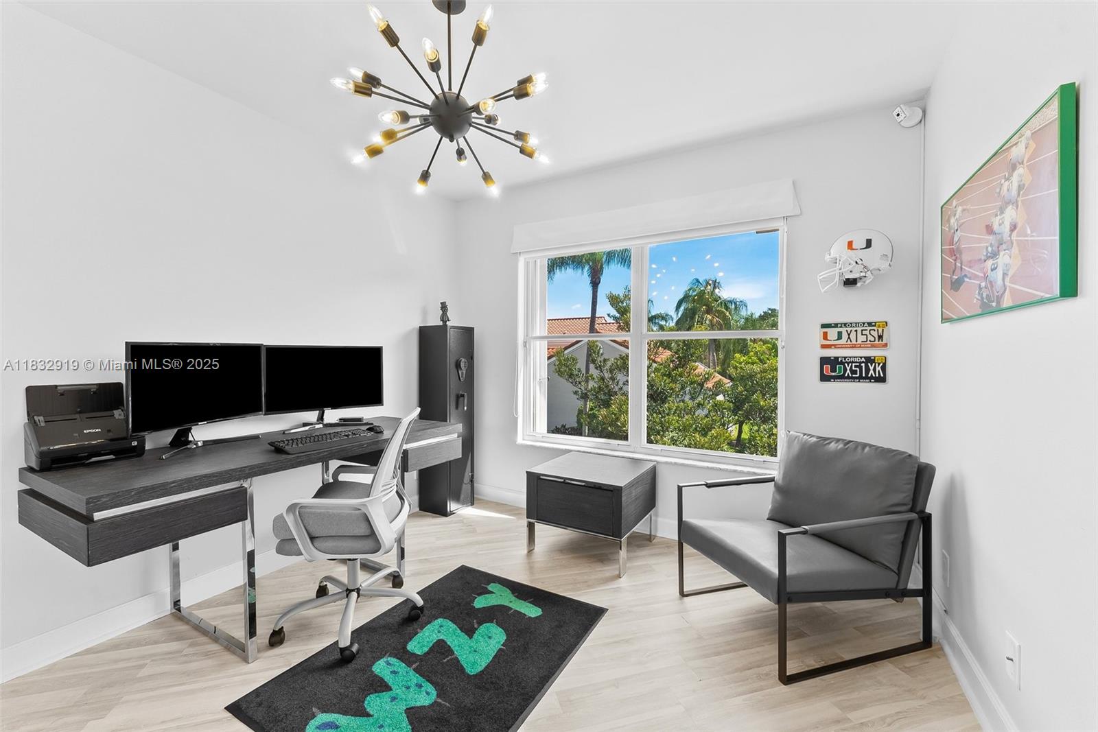 17723 Tiffany Trace Drive Boca Raton, FL 33487 - Photo 38 of 44 a work room with furniture a flat screen tv and a large window