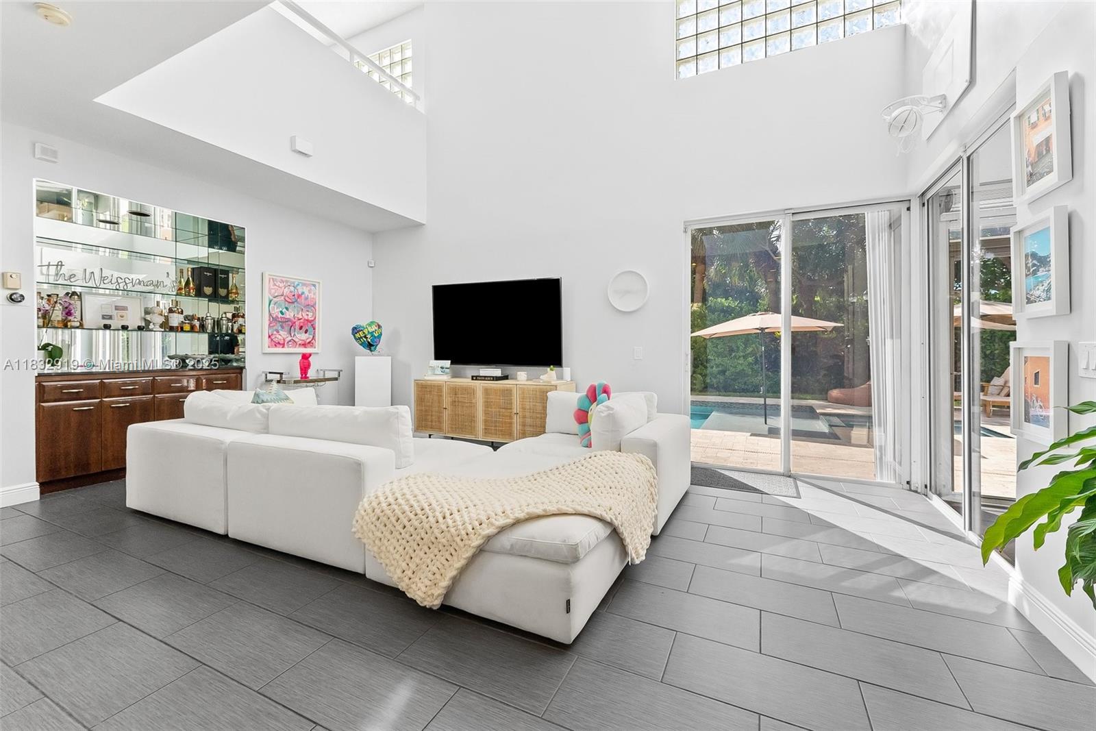17723 Tiffany Trace Drive Boca Raton, FL 33487 - Photo 5 of 44 a living room with furniture and a flat screen tv