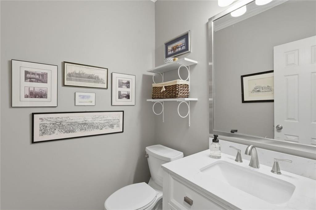 215 Bayfield Court Milton, GA 30004 - Photo 23 of 62 a bathroom with a toilet sink and mirror