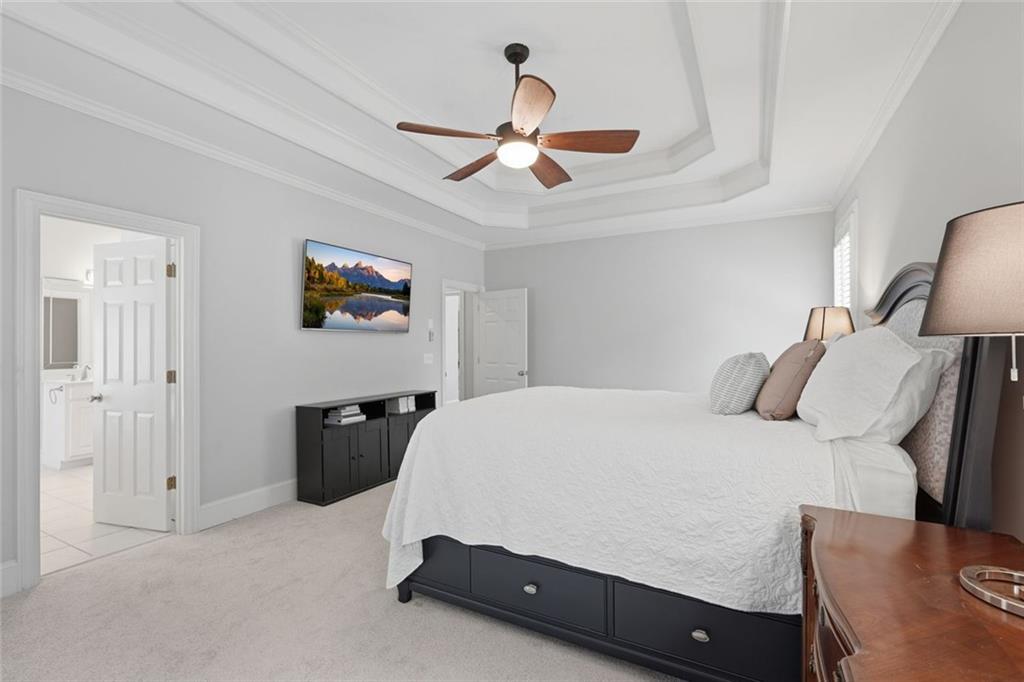 215 Bayfield Court Milton, GA 30004 - Photo 25 of 62 a bedroom with a bed dresser and a window