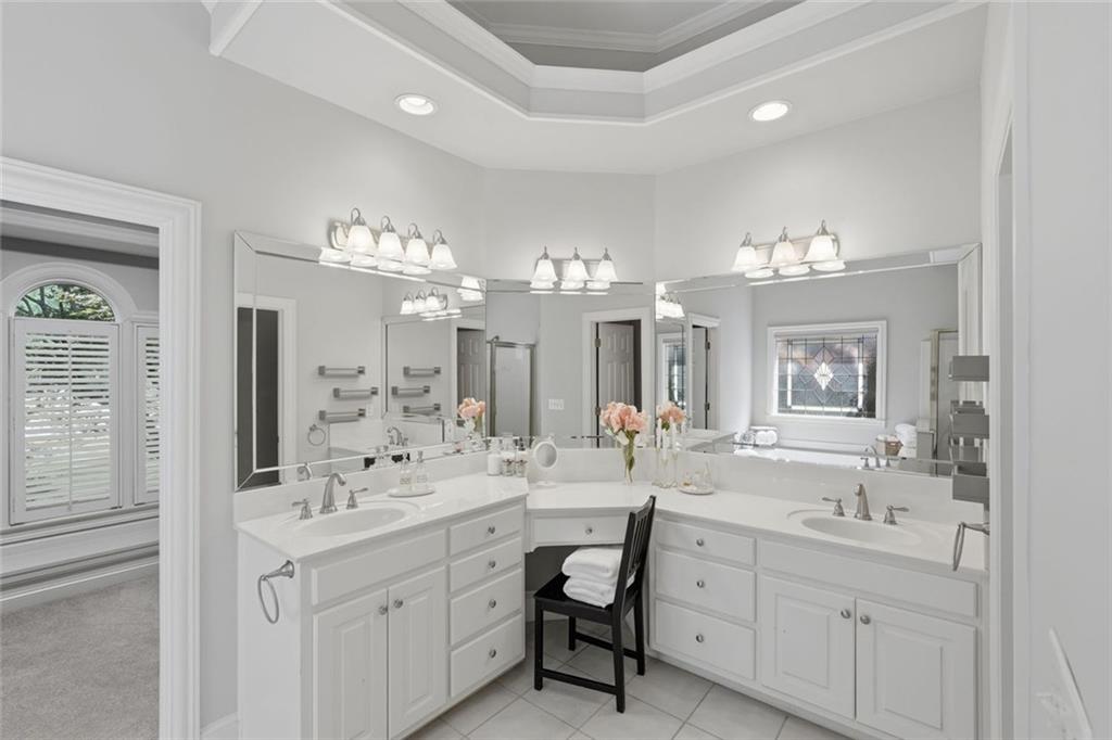 215 Bayfield Court Milton, GA 30004 - Photo 26 of 62 a bathroom with a sink double vanity and a mirror