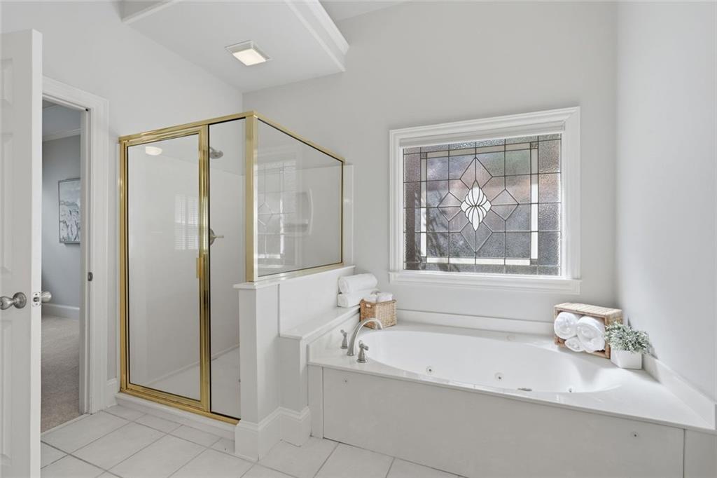 215 Bayfield Court Milton, GA 30004 - Photo 27 of 62 a bathroom with a bathtub and a sink