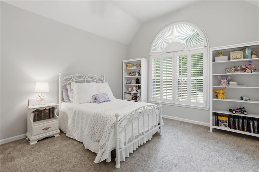 215 Bayfield Court Milton, GA 30004 - Photo 33 of 62 a bedroom with a bed a dresser and a large window