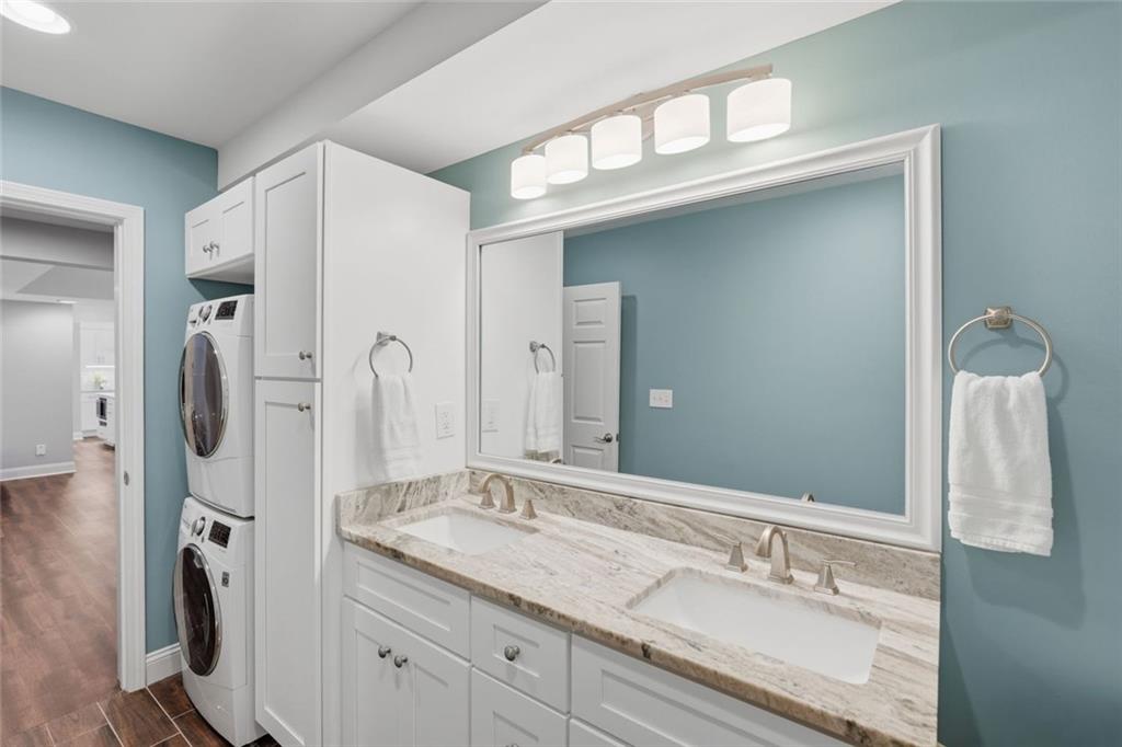 215 Bayfield Court Milton, GA 30004 - Photo 40 of 62 a bathroom with a sink double vanity and a mirror