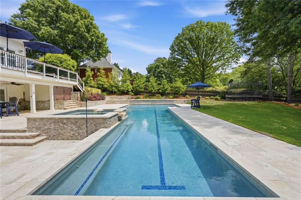 215 Bayfield Court Milton, GA 30004 - Photo 52 of 62 a view of swimming pool with outdoor seating and plants