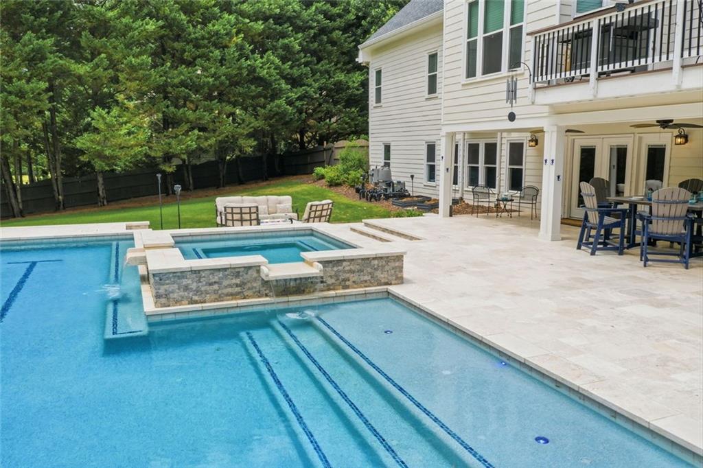 215 Bayfield Court Milton, GA 30004 - Photo 56 of 62 a view of a swimming pool with chairs