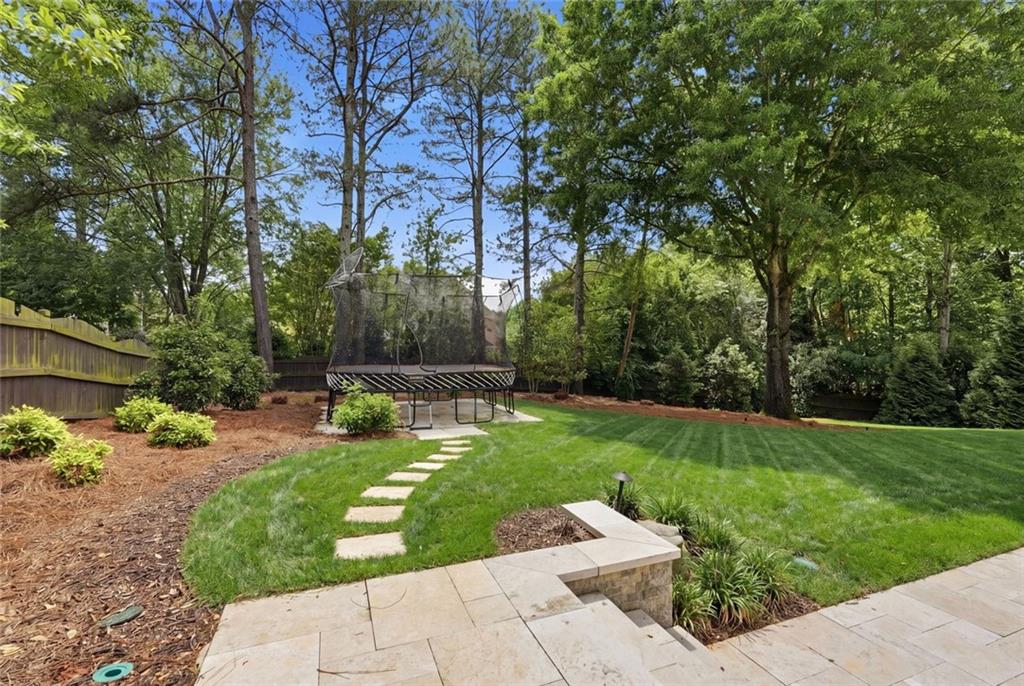 215 Bayfield Court Milton, GA 30004 - Photo 60 of 62 a view of backyard with a garden and entertaining space