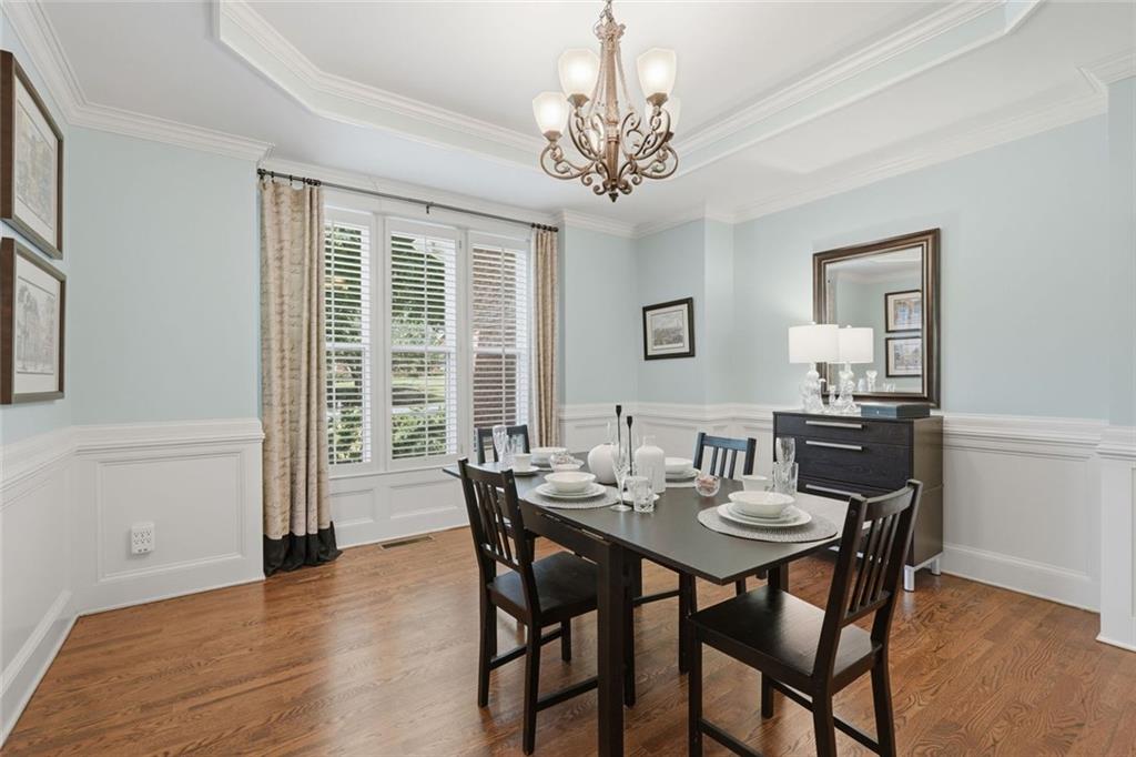 215 Bayfield Court Milton, GA 30004 - Photo 6 of 62 a view of a dining room with furniture and wooden floor