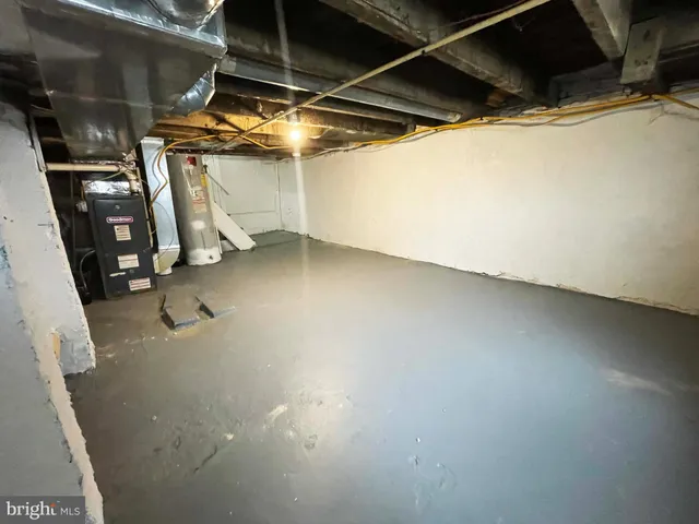 a view of walk in closet with clothes