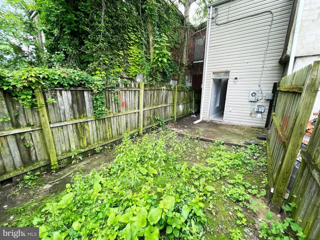 a view of a backyard with a garden