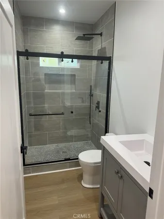 a bathroom with a shower and a sink