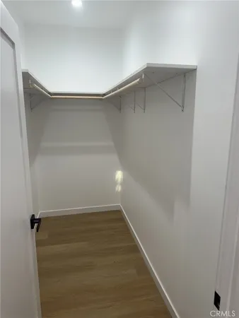 a view of an empty walk in closet