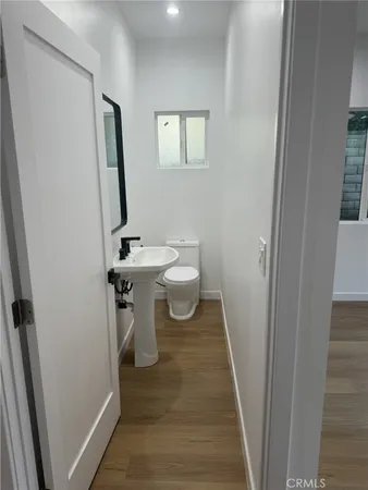 a view of a bathroom from a hallway