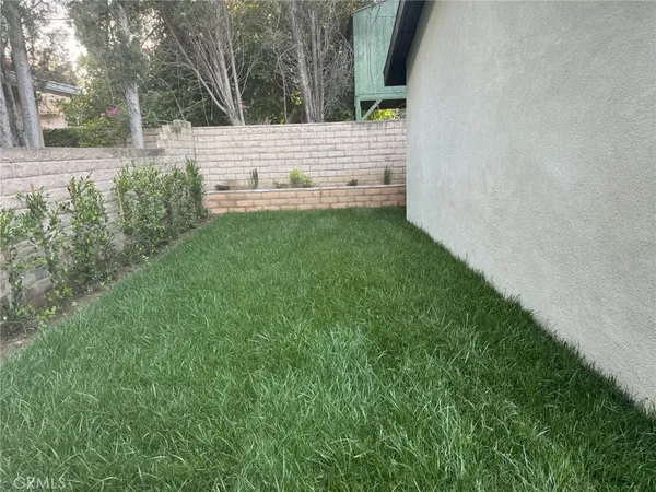 a view of a bench in a yard