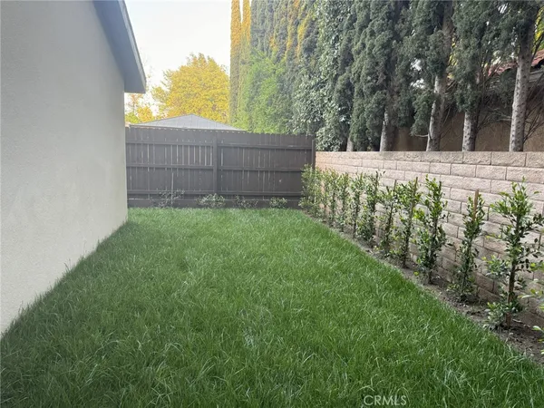 a view of a backyard with green space