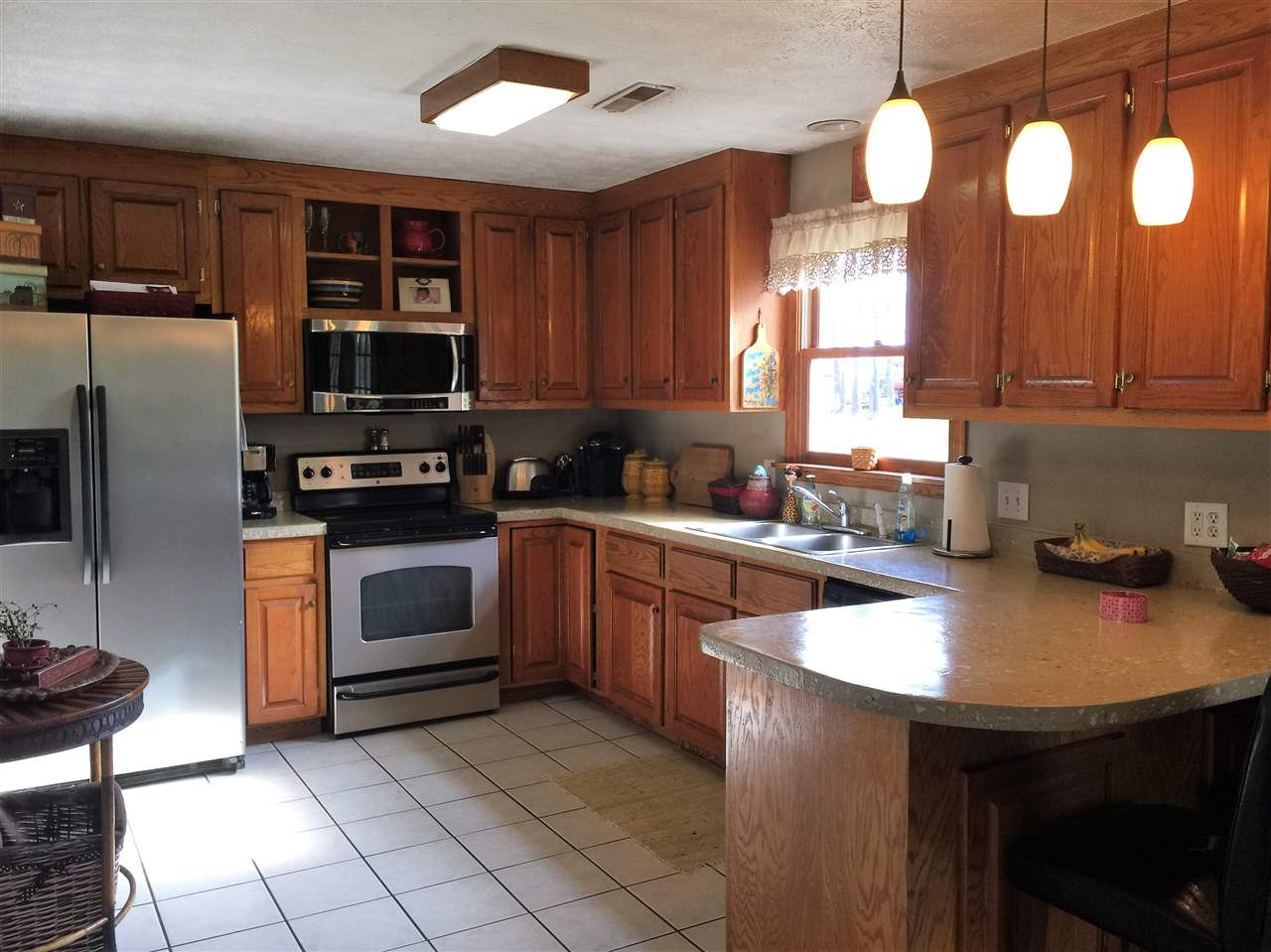 34 Swartzel Shop Road Staunton, VA 24401 - Photo 22 of 47 a kitchen with stainless steel appliances granite countertop a sink wooden cabinets and a stove top oven