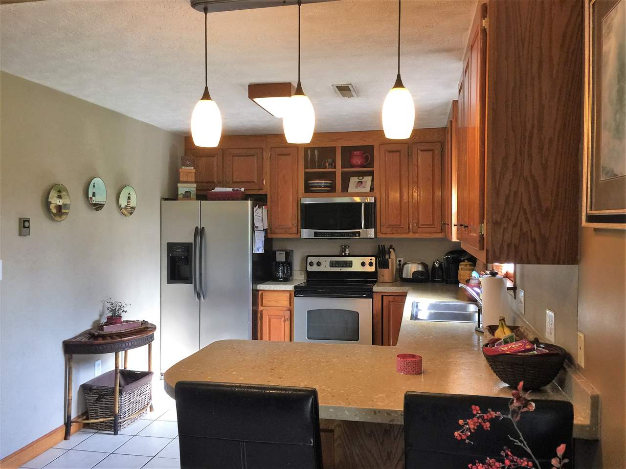 34 Swartzel Shop Road Staunton, VA 24401 - Photo 24 of 47 a kitchen with stainless steel appliances kitchen island granite countertop a sink a stove and a refrigerator