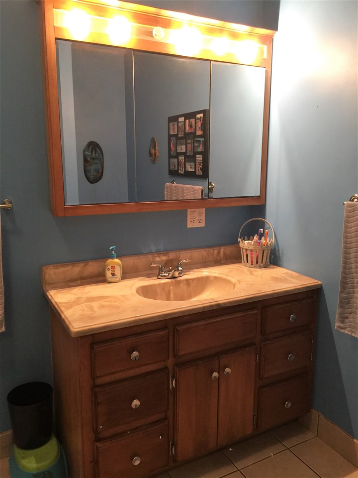 34 Swartzel Shop Road Staunton, VA 24401 - Photo 35 of 47 a bathroom with a sink and a mirror