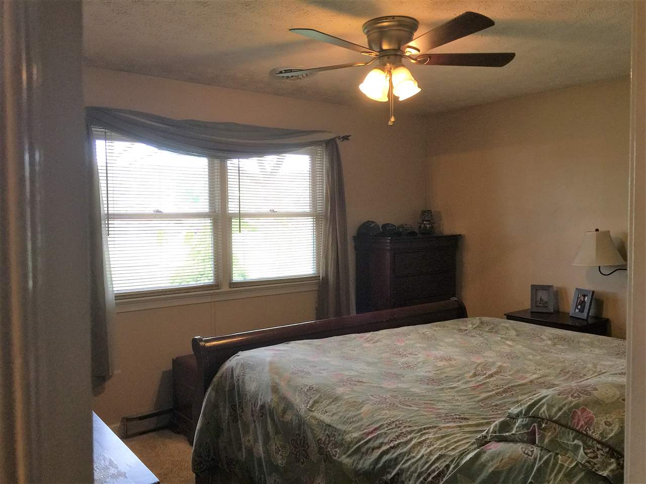 34 Swartzel Shop Road Staunton, VA 24401 - Photo 37 of 47 a bedroom with a bed and a chandelier