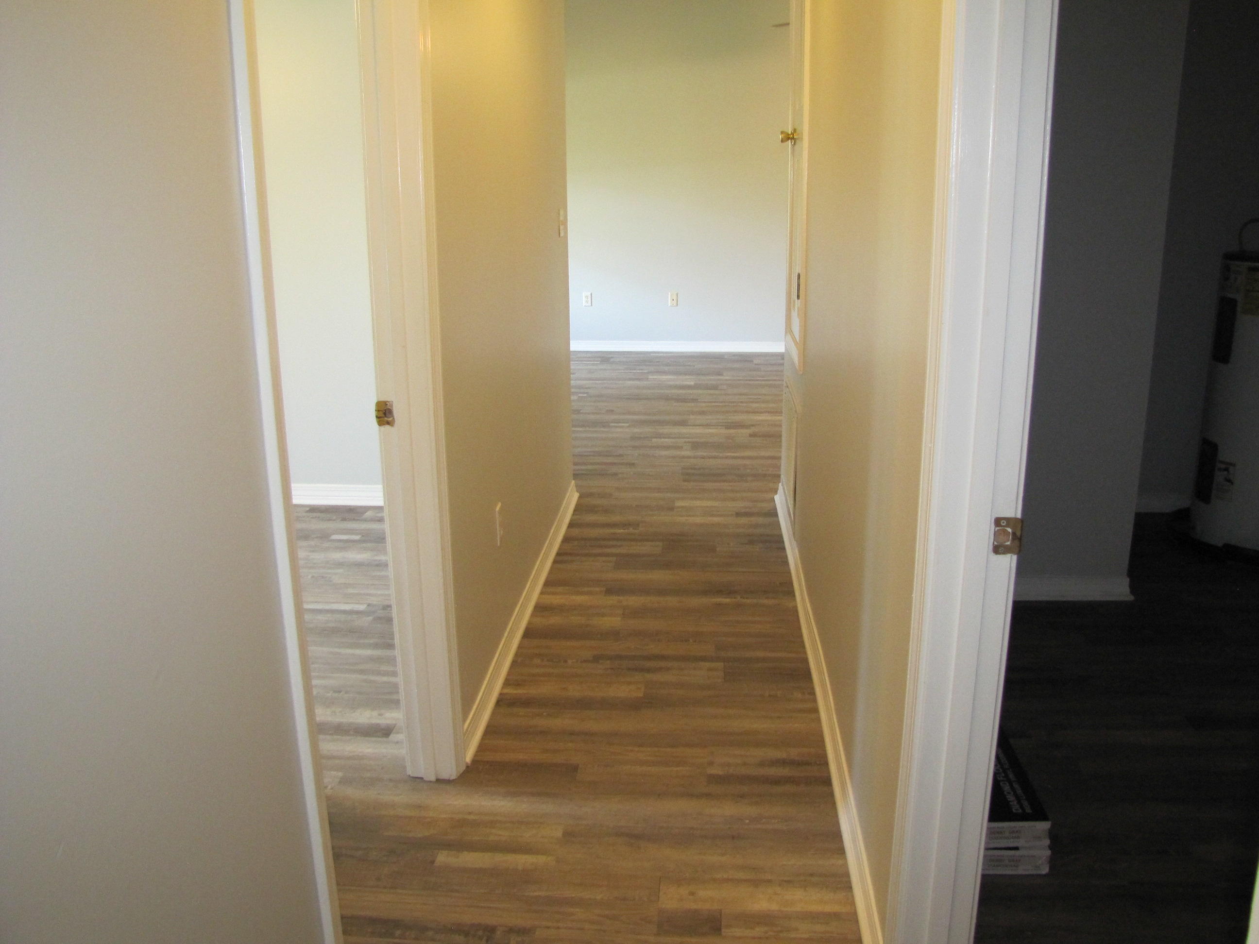 13 Initial Lane Santa Rosa Beach, FL 32459 - Photo 21 of 24 a view of a hallway with wooden floor and staircase