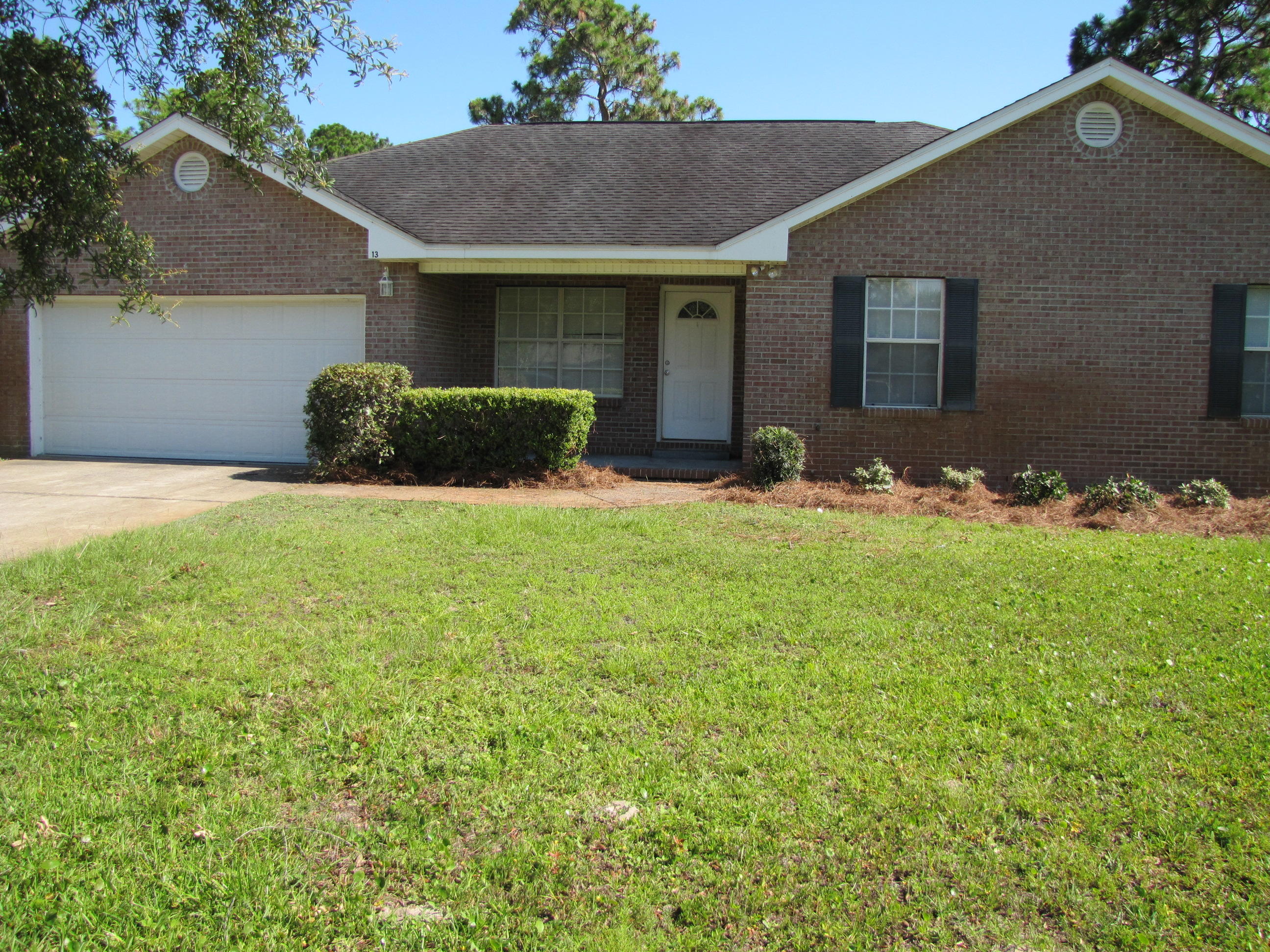 13 Initial Lane Santa Rosa Beach, FL 32459 - Photo 24 of 24 a front view of a house with yard and garage