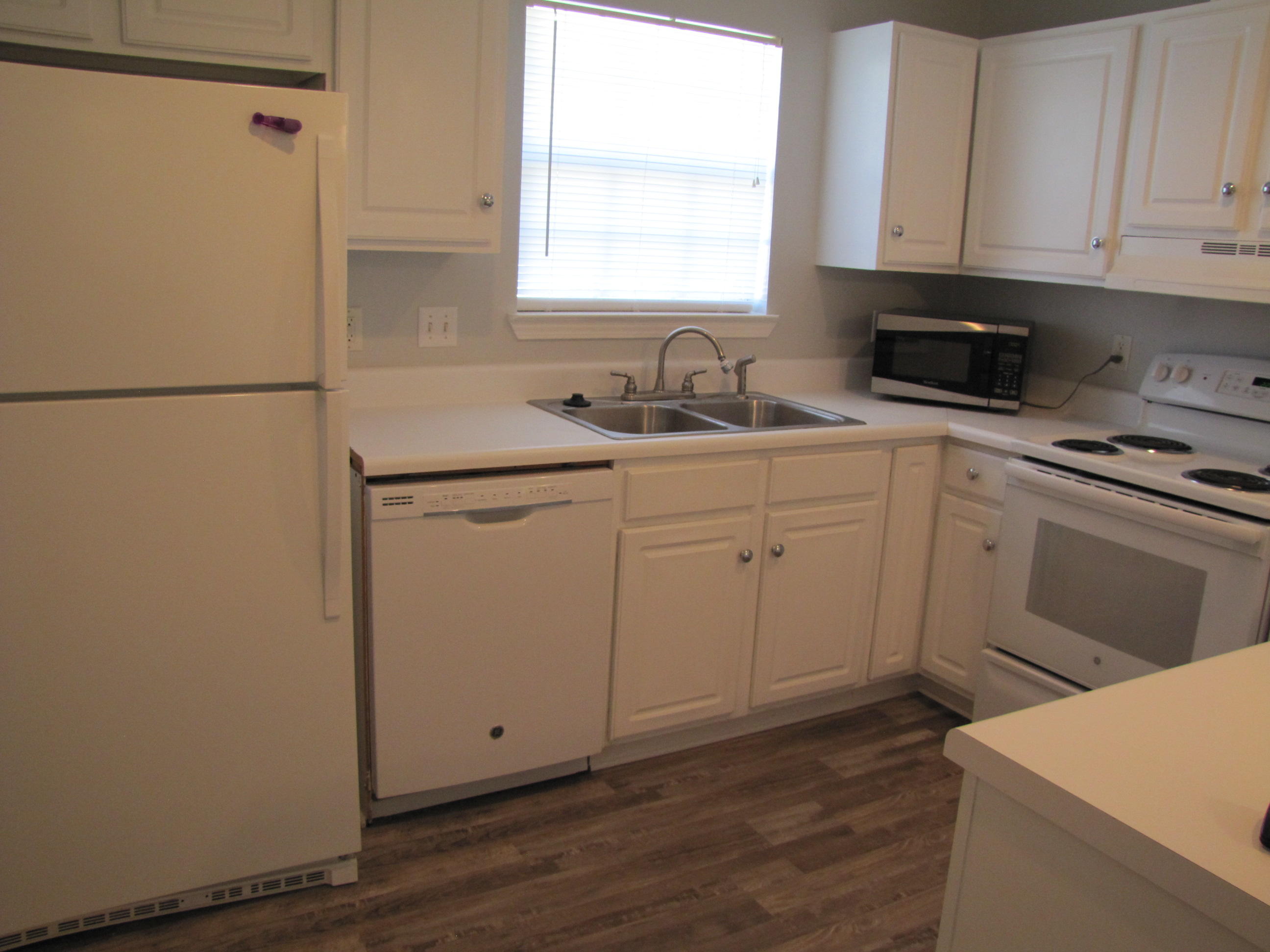 13 Initial Lane Santa Rosa Beach, FL 32459 - Photo 5 of 24 a kitchen with cabinets appliances a sink and a window