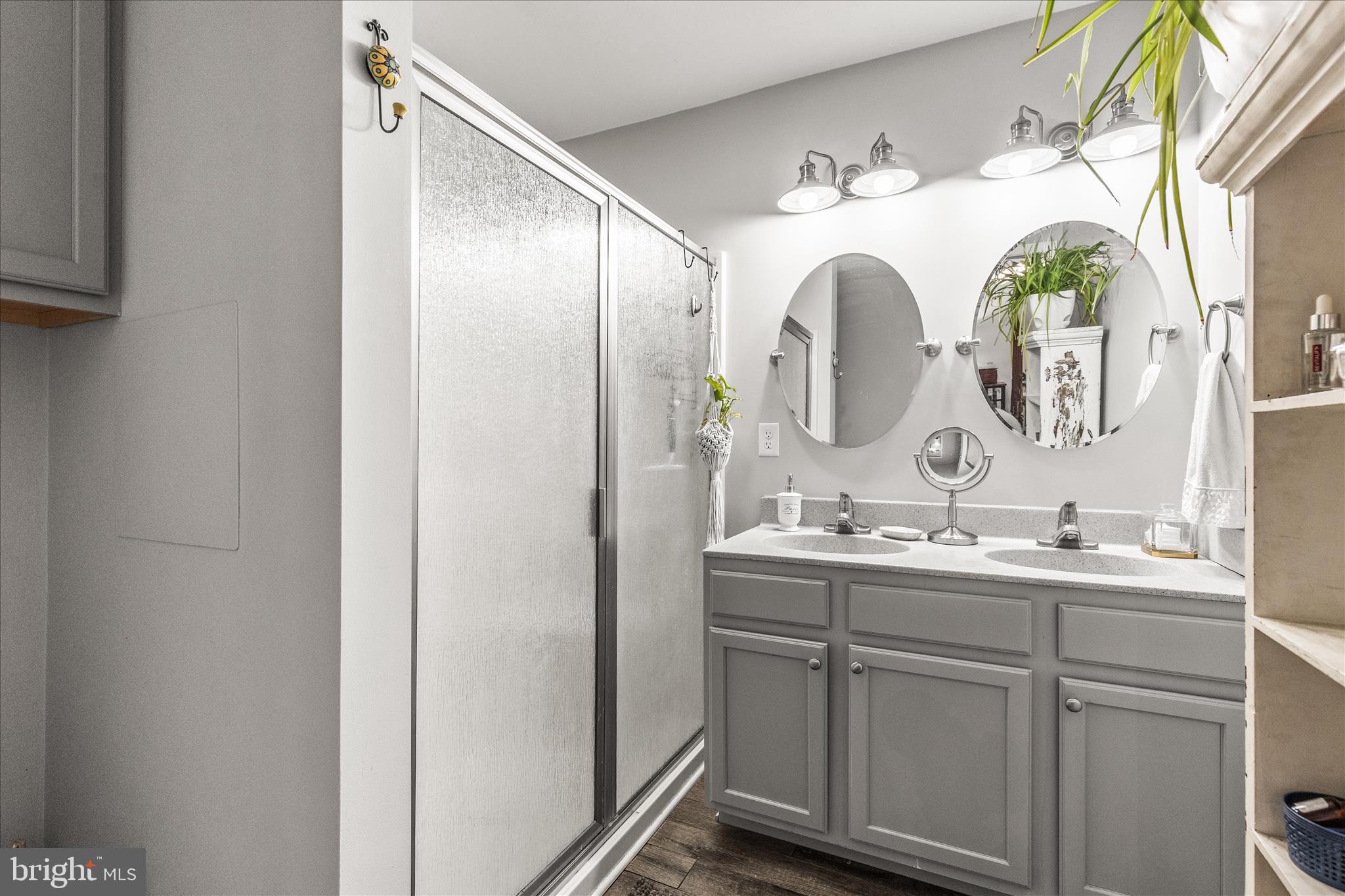 813 West Middle Street Hanover, PA 17331 - Photo 18 of 30 a bathroom with a double vanity sink and a mirror