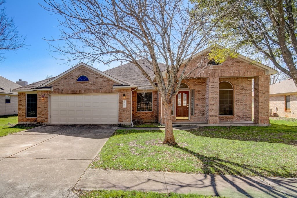 1509 Emblem Drive Pflugerville, TX 78660 - Photo 1 of 1 a front view of a house with a yard