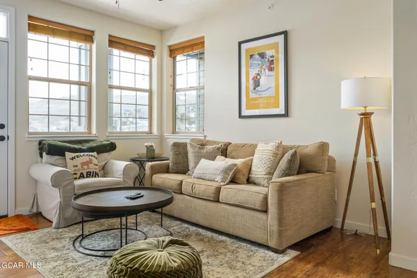 a living room with furniture and a window