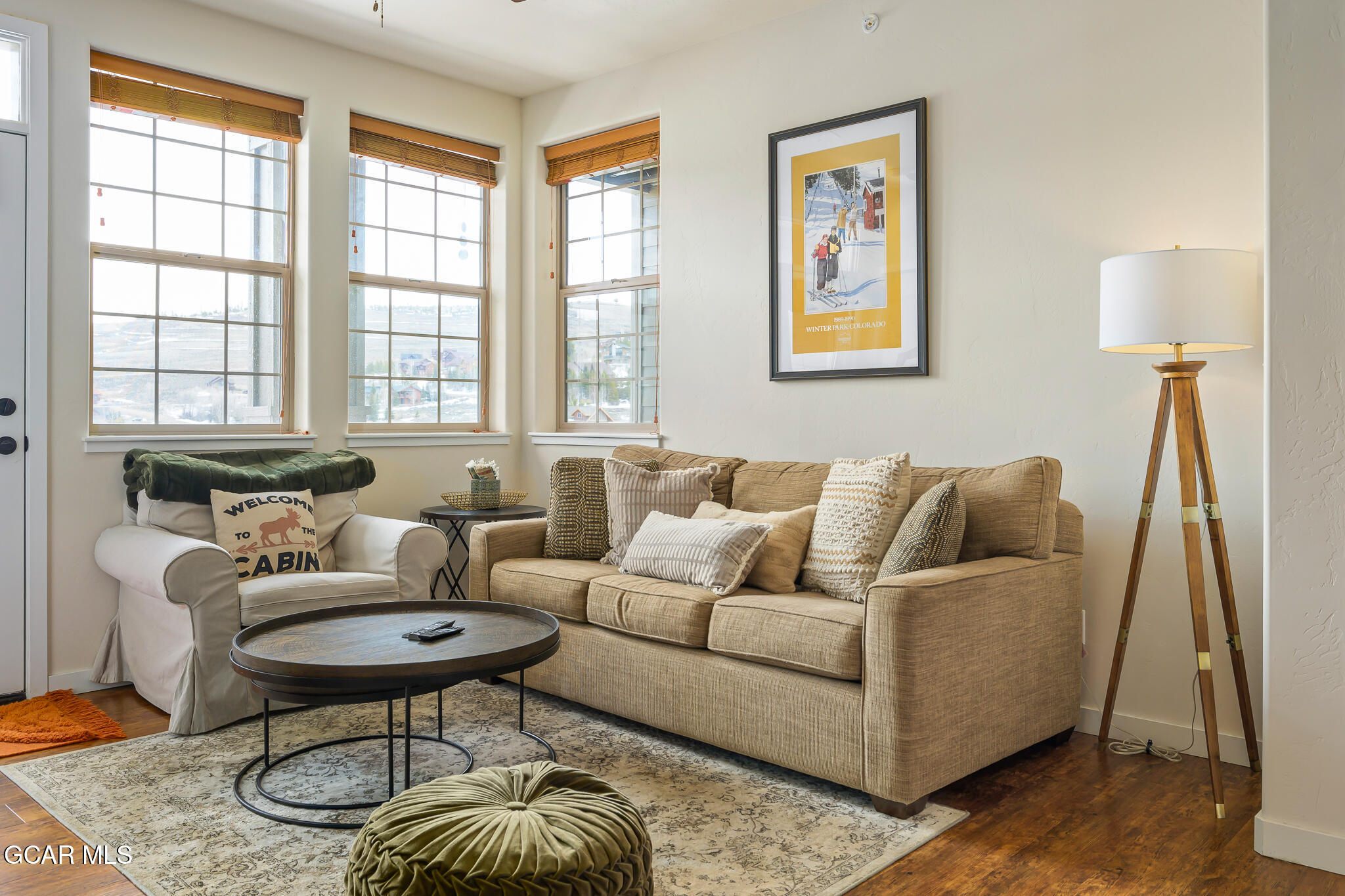 a living room with furniture and a window