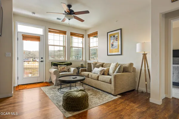 a living room with furniture and a large window