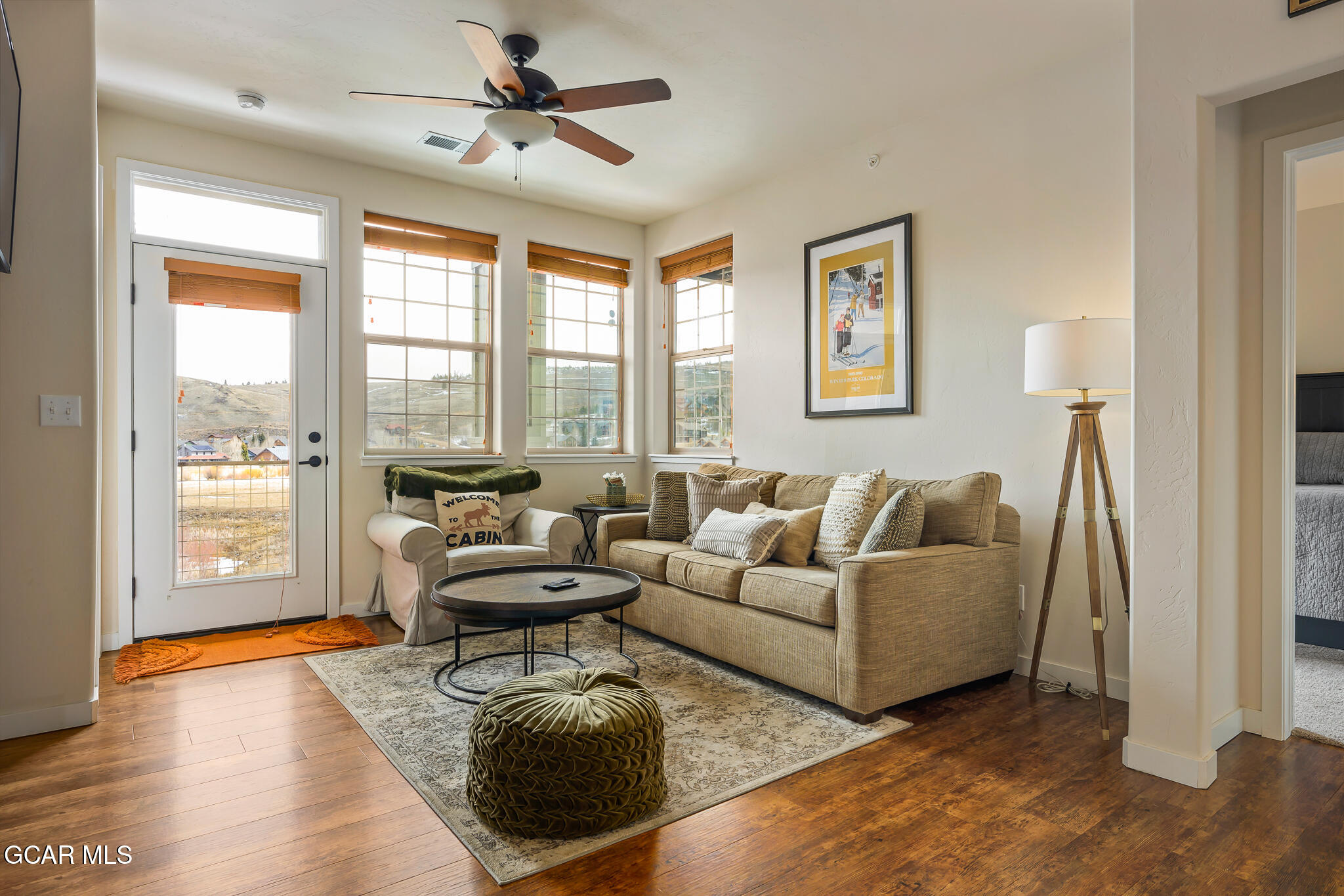 164 Village Road, Unit H203 Granby, CO 80446 - Photo 15 of 38 a living room with furniture and a large window