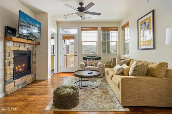 a living room with furniture and a fireplace