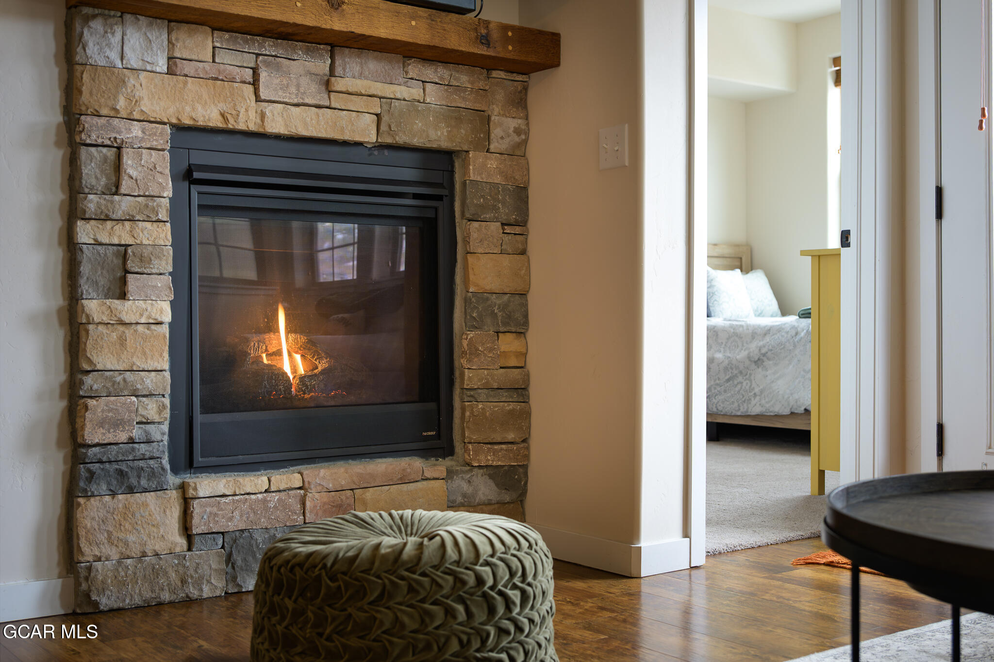 164 Village Road, Unit H203 Granby, CO 80446 - Photo 17 of 38 a bedroom with a bed and a television