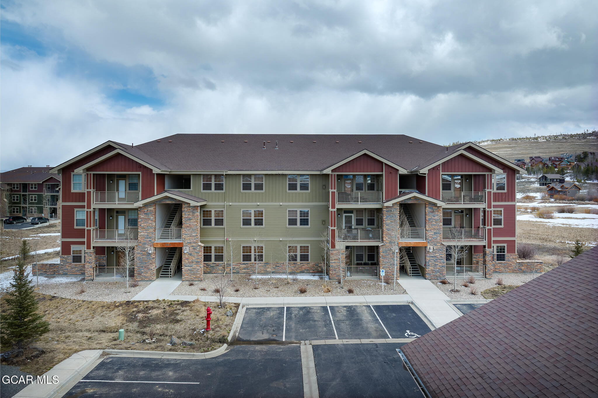 164 Village Road, Unit H203 Granby, CO 80446 - Photo 2 of 38 a front view of a house with a yard