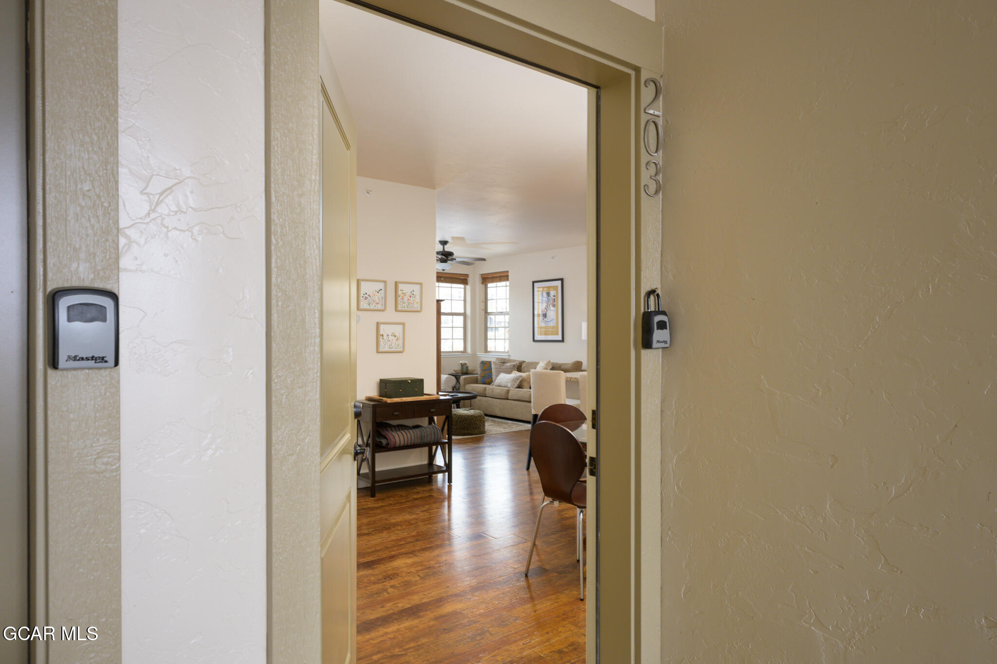 164 Village Road, Unit H203 Granby, CO 80446 - Photo 21 of 38 a view of a dining hall with furniture and wooden floor