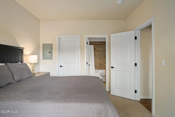 a bedroom with a bed and a couch