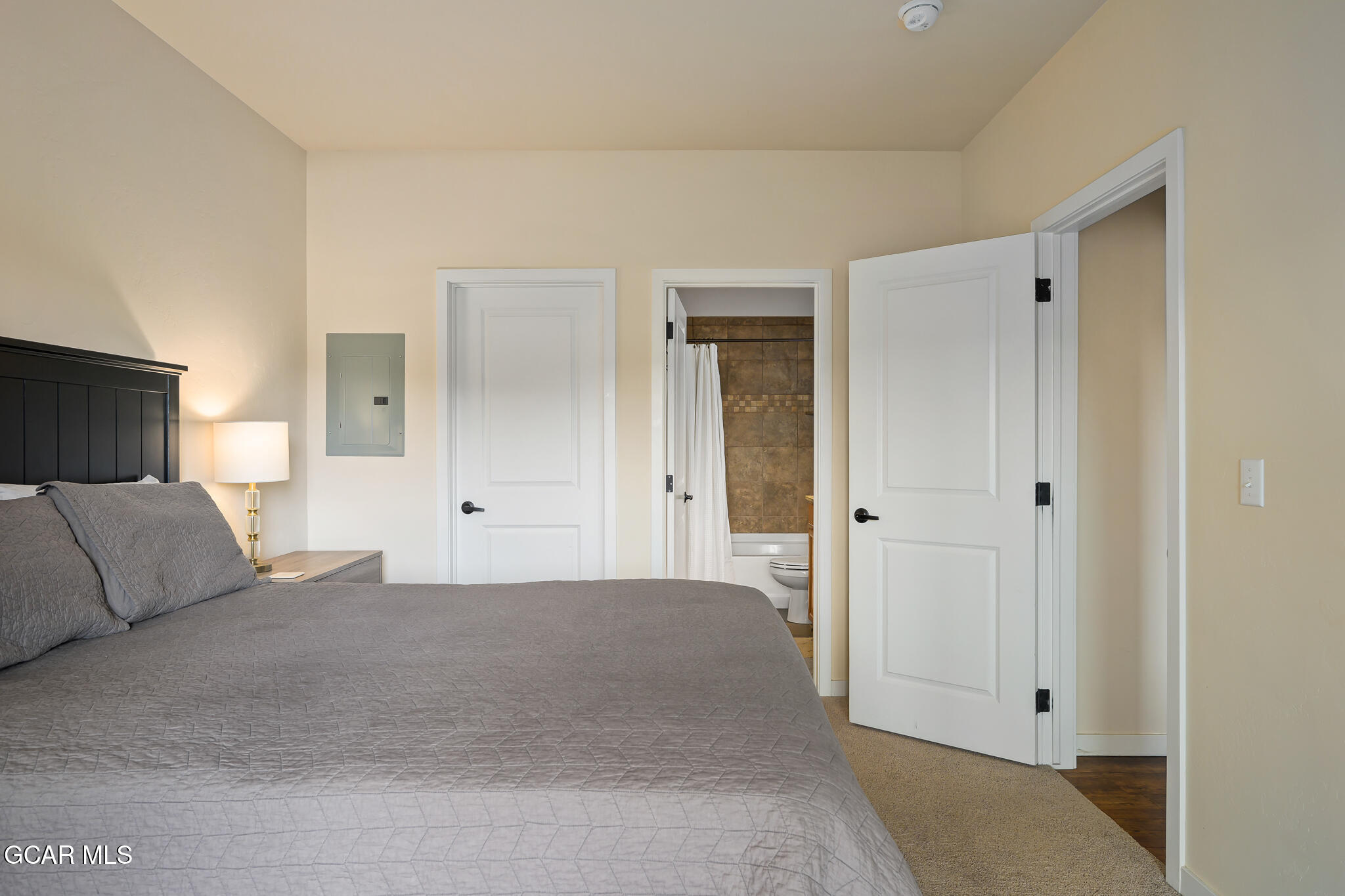 164 Village Road, Unit H203 Granby, CO 80446 - Photo 23 of 38 a bedroom with a bed and a couch